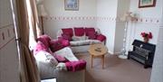 Lounge area at Sandmoor Holiday Apartments, Paignton, Devon