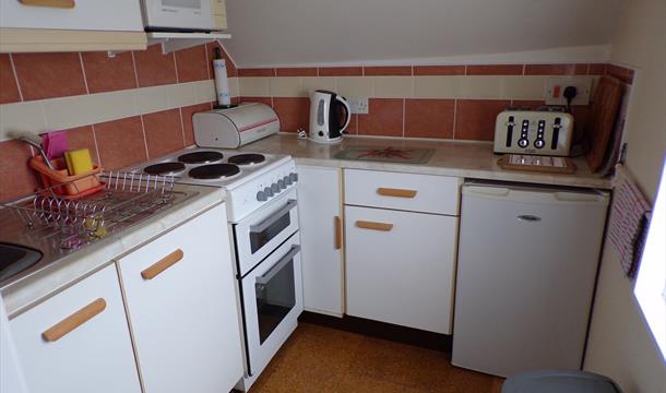 Kitchen area at Sandmoor Holiday Apartments, Paignton, Devon