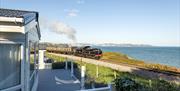 View of the steam train passing Waterside Holiday Park, Paignton, Devon