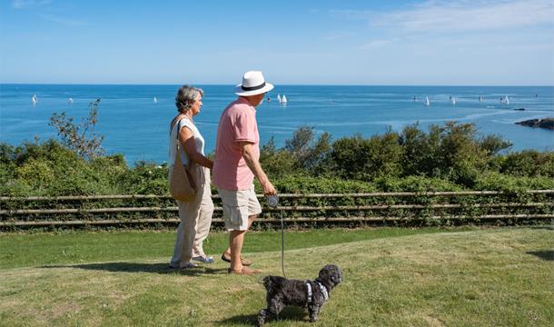 Couple looking across St Mary's Bay from Riviera Bay Coastal Retreat Couple looking across St Mary's Bay from Riviera Bay Coastal Retreat