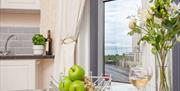 Kitchen with sideways sea view at Bedford Holiday Apartments, Adelphi Road, Paignton, Devon