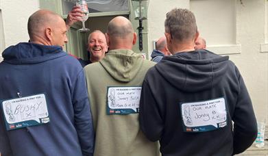 Gary Adderley toasting 'Bushy' at The Big Tackle, Rowcroft Hospice, Torquay, Devon