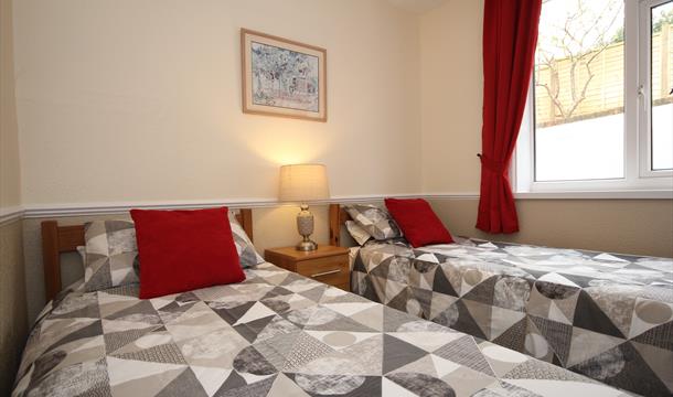 Bedroom at Big Tree Holiday Flats, Paignton, Devon