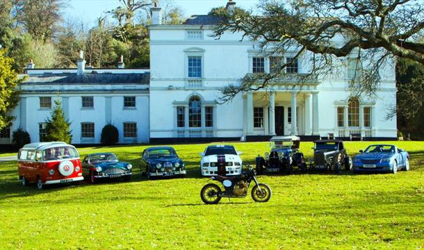 Classic vehicles parked in front of Lupton House, Brixham, Devon