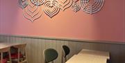 An interior shot of Costa Coffee Quaywest showing heart decoration on the wall.