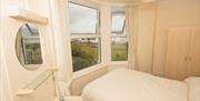 Bedroom with a view at Adelphi Holiday Apartments in Paignton, Devon