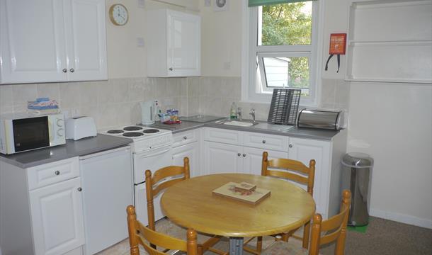Kitchen/Dining area at Broadshade Holiday Flats, Paignton, Devon