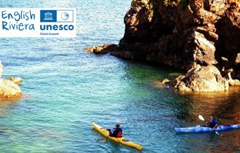 Kayakers in the sea, English Riviera UNESCO Global Geopark.