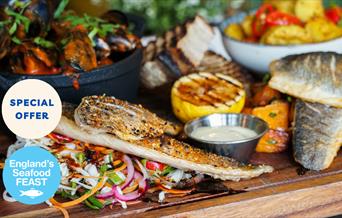 A seafood platter on a wooden board, part of England's Seafood FEAST, English Riviera