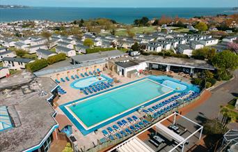 Overhead pool view of Beverley Holidays, Paignton, with sea in background