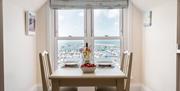 Stepaside Apartments in Brixham, dining area overlooking the marina