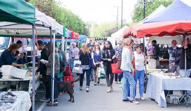 A great picture of Blackheath Market, showing rows of stalls filled with farmers produce.