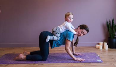 A memorable family yoga class to help new parents bond with their baby in a magnificent setting