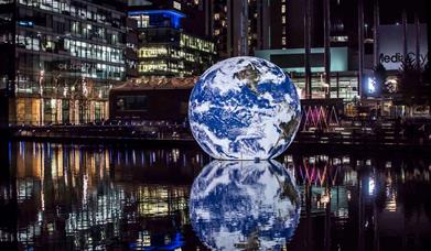 Floating Earth, a magical globe by artist Luke Jerram will be floating in the water of Middle Dock