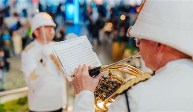 Get in the festive spirit with free musical performances on the iconic golden staircase at the Outlet Shopping at The O2, Greenwich Peninsula