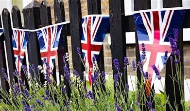 Watch the Coronation of HM King Charles III on the Woolwich big screen
