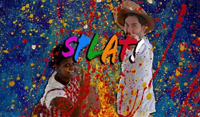 A female and male artist splattering paint from paint brushes towards their audience