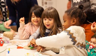 Three children making rope creations