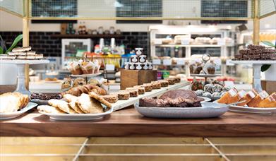 Located inside the Cutty Sark Café, showing a room filled with delicious snacks.