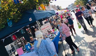 A look into Eltham's producer market, showing a range of stalls each with their own unique items and foods.