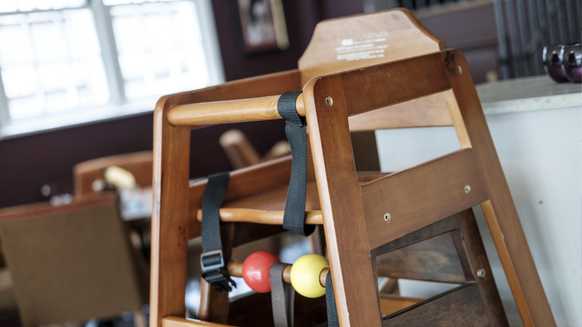 A wooden high chair.