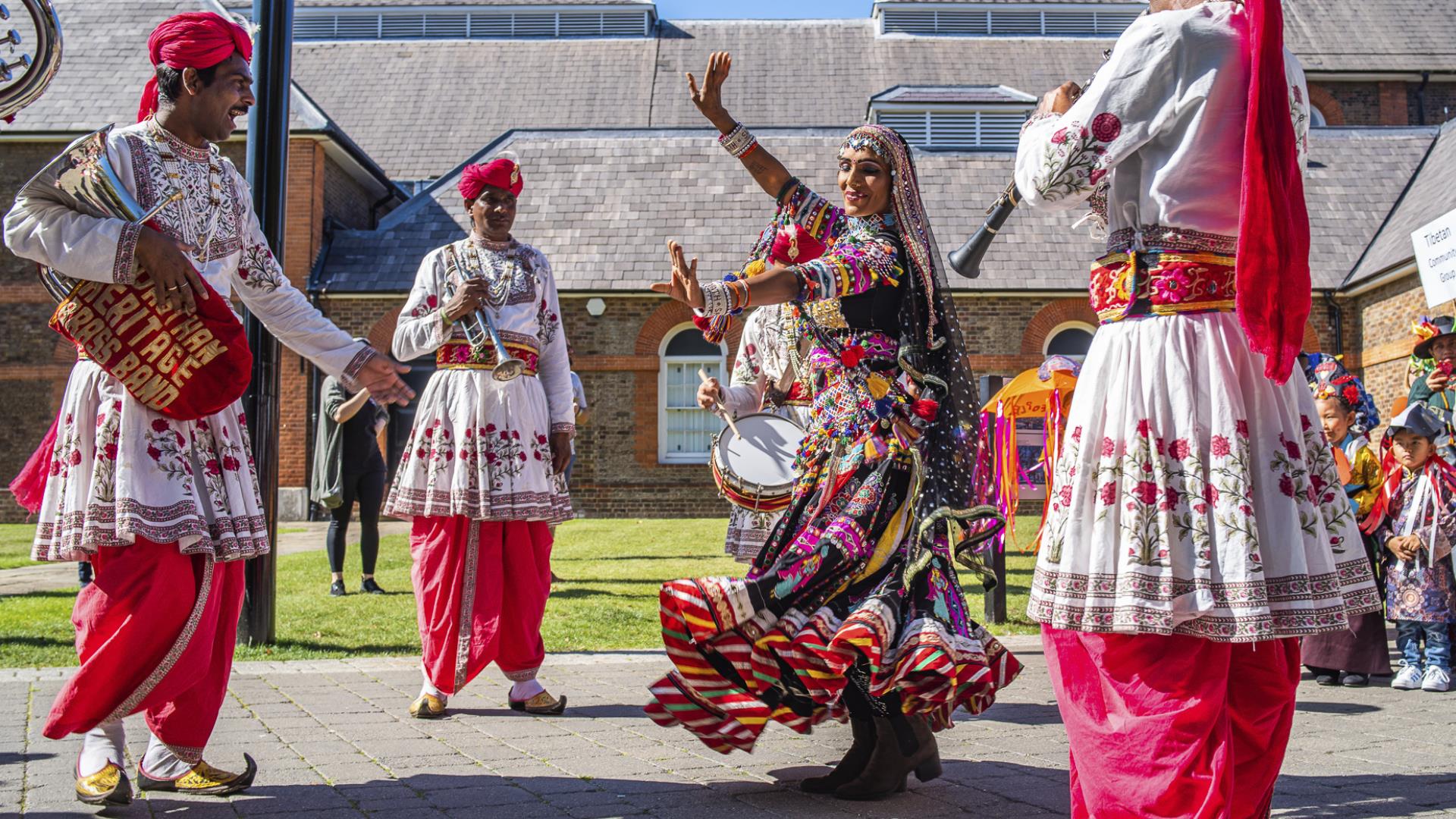 A woman dances to music at Woolwich Carnival.