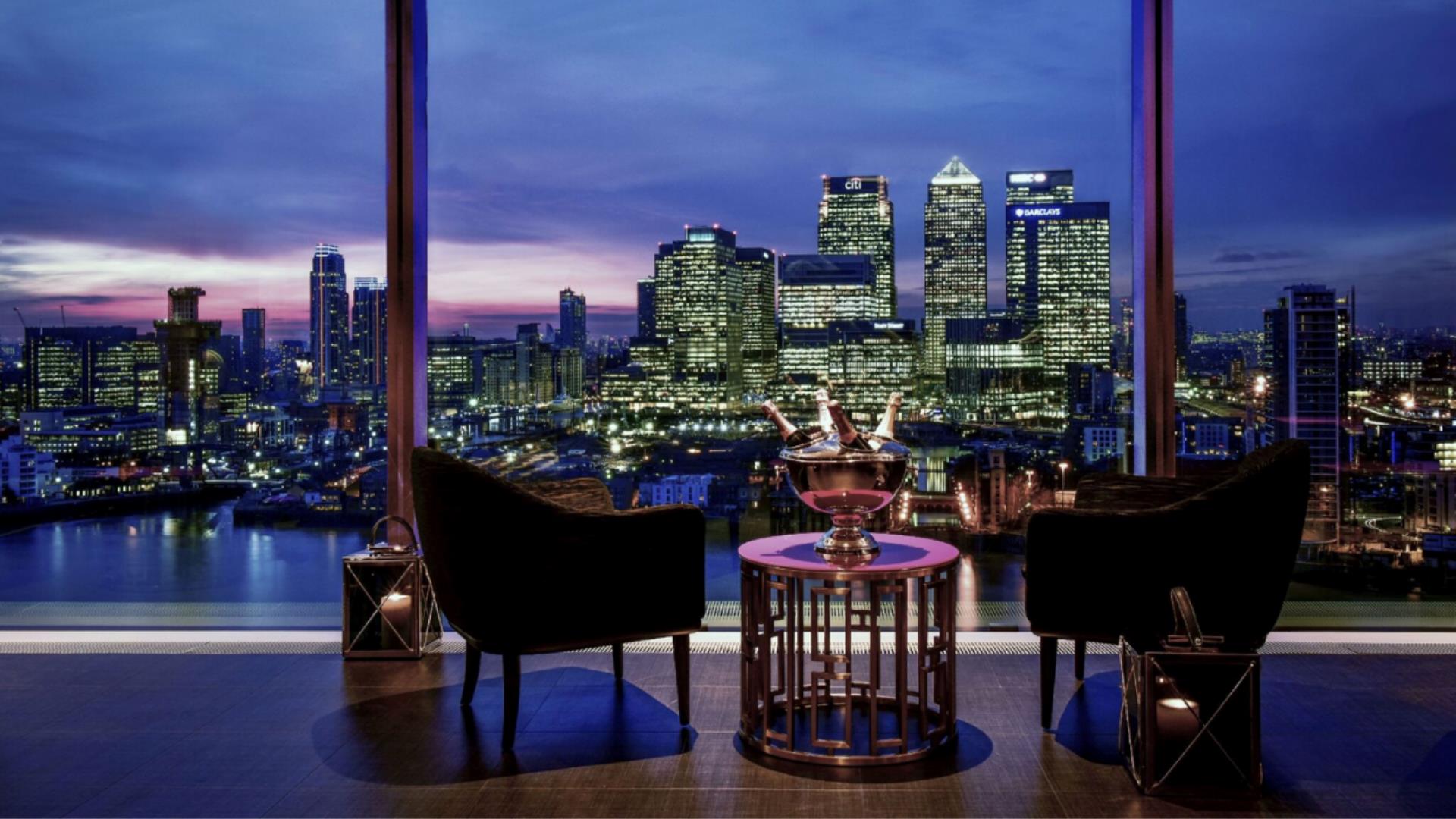 The Eighteen Sky Bar at the InterContinental London - The O2 at night, with a view of Canary Wharf's twinkling lights.