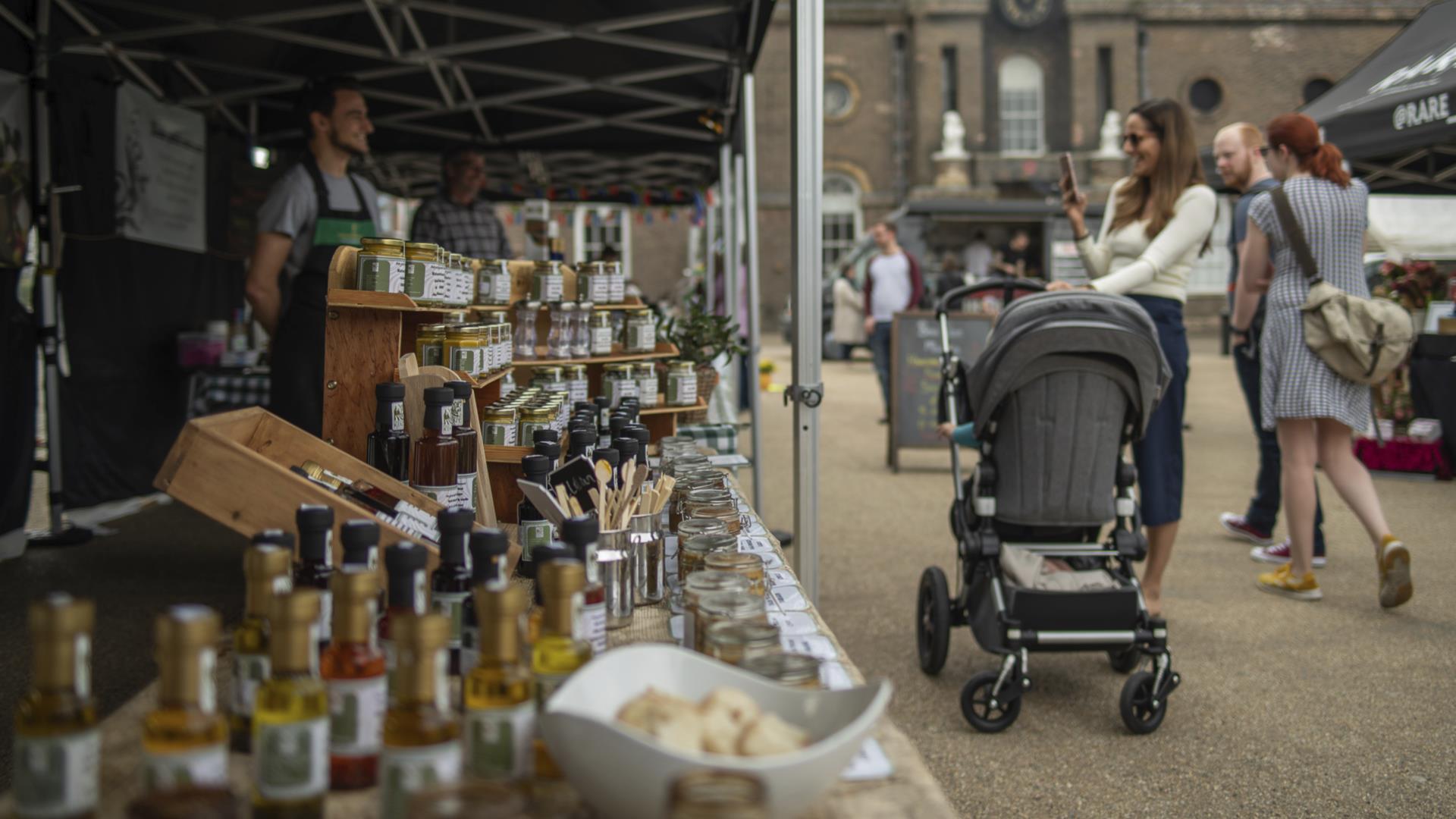 People shop from the stalls at Royal Arsenal Farmers' Market in Woolwich.