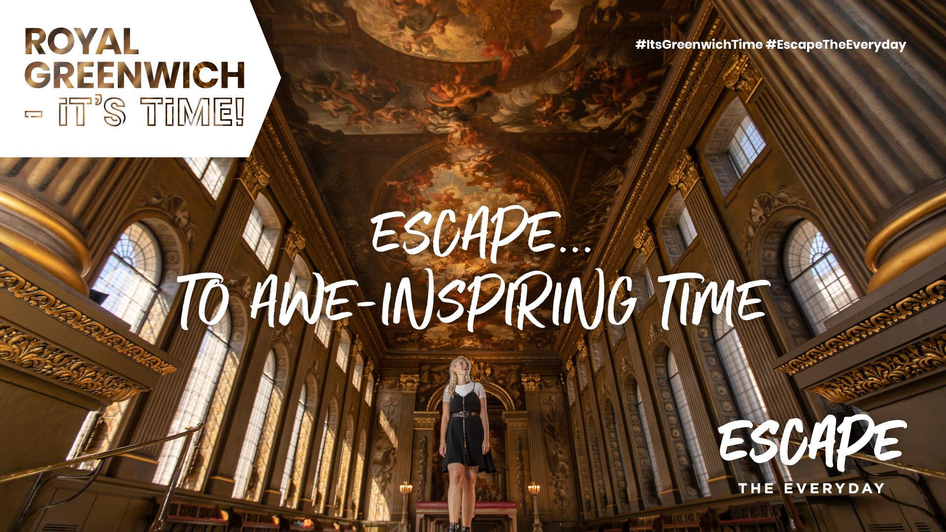A woman looks up in awe at the ceiling of the Painted Hall at the Old Royal Naval College in Greenwich.