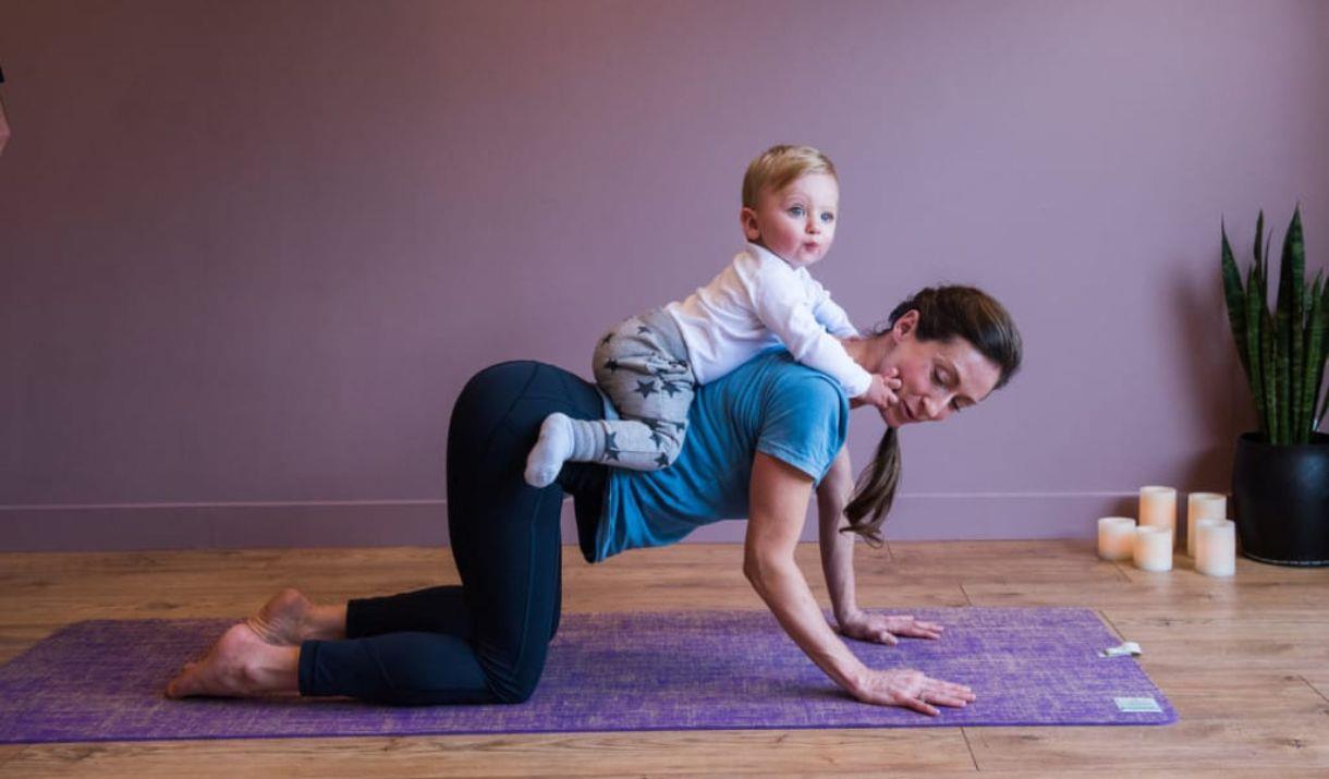 A memorable family yoga class to help new parents bond with their baby in a magnificent setting