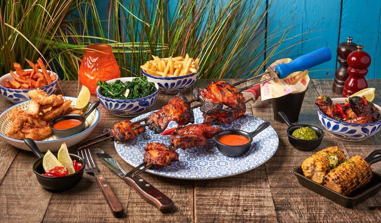 Latin American inspired cuisine with marinated meat skewers grilled fresh to order, alongside small plates of appitisers of street food with a vibrant