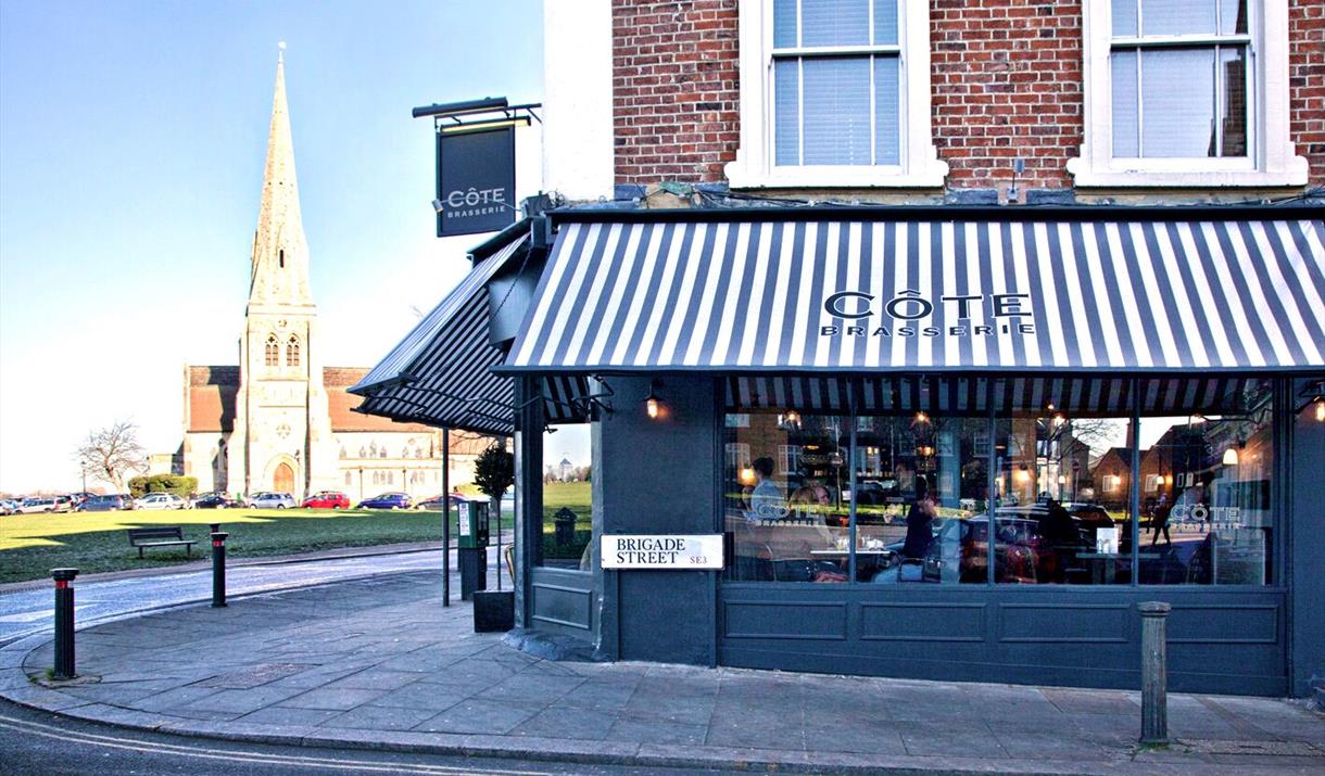 Outside Cote Brasserie Blackheath, an elegant building onlooking Blackheath common.