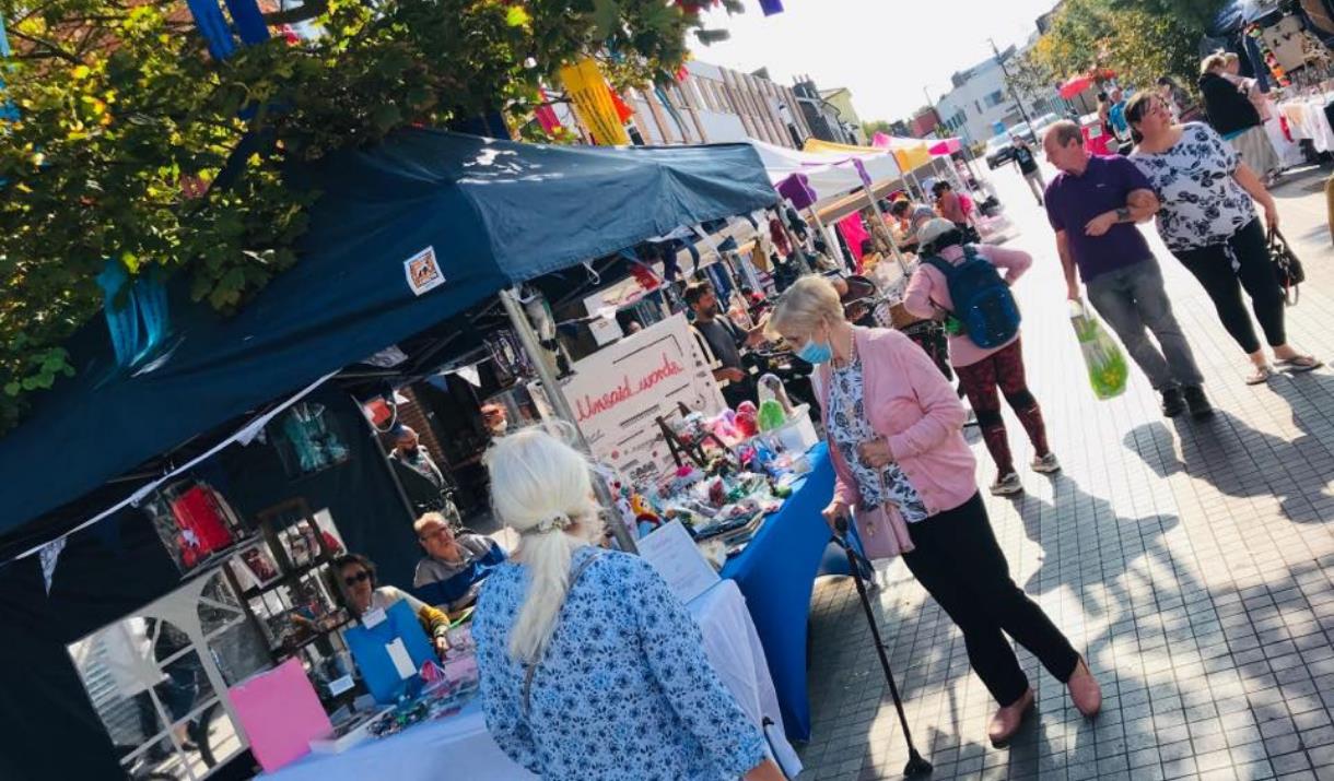 A look into Eltham's producer market, showing a range of stalls each with their own unique items and foods.