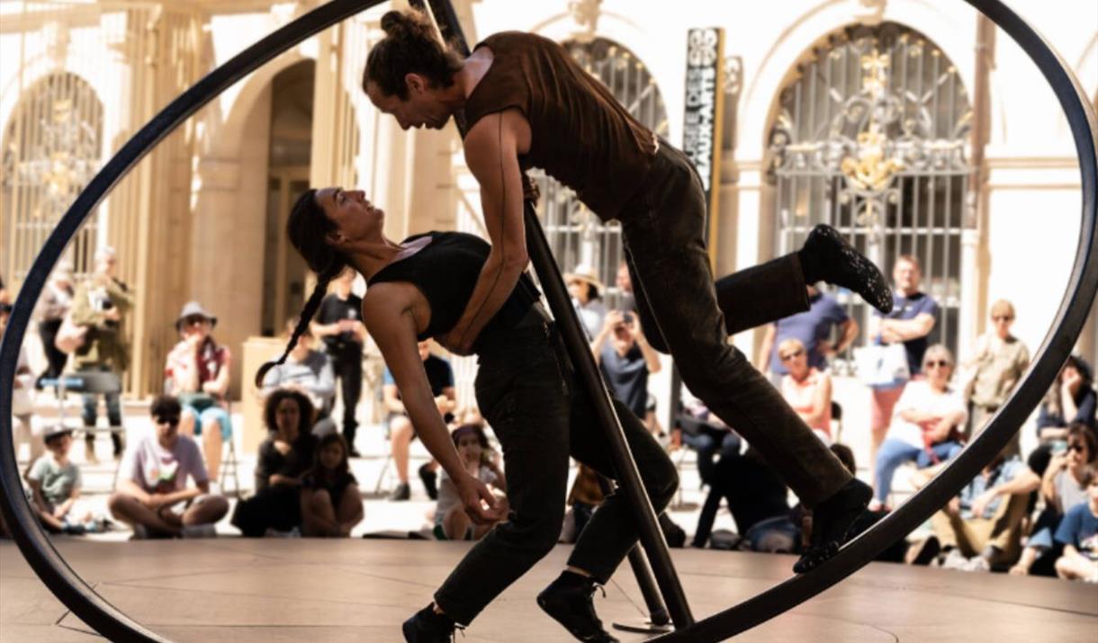 An ingeniously designed circular installation becomes the playground for two perfectly poised performers