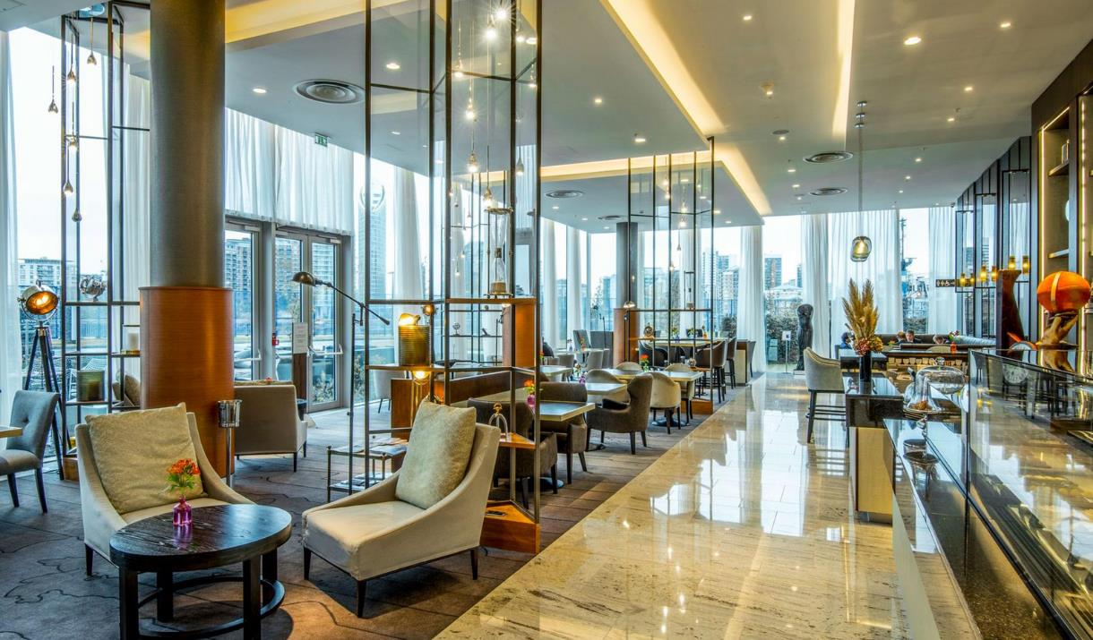 The bright and airy Meridian Lounge at InterContinental London - The O2 has stunning views through the floor to ceiling windows of the river Thames an