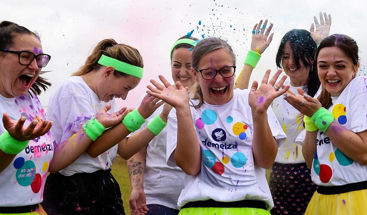 A group of adults taking part in the Rainbow Run