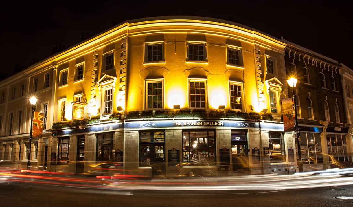 Night view of the historic 19th century building well lit up at one corner of the Greenwich Market.