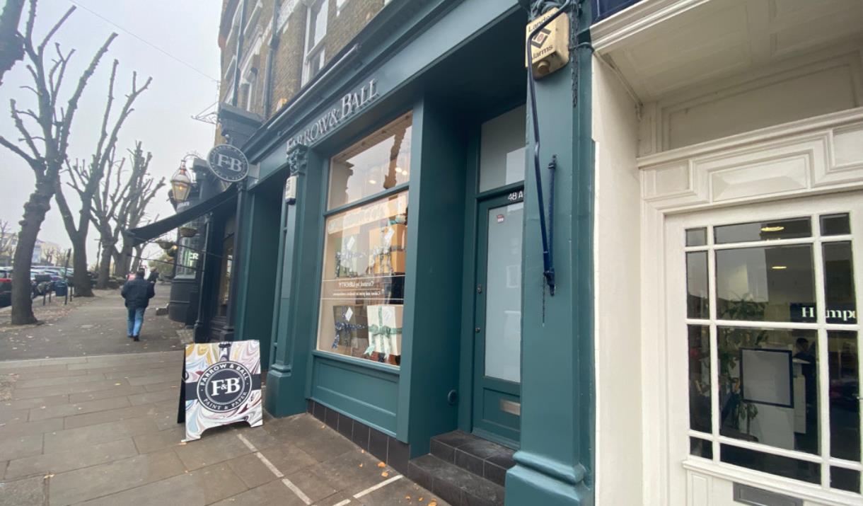 Farrow and Ball in Blackheath. Showing a green shopfront with an elegant inside.