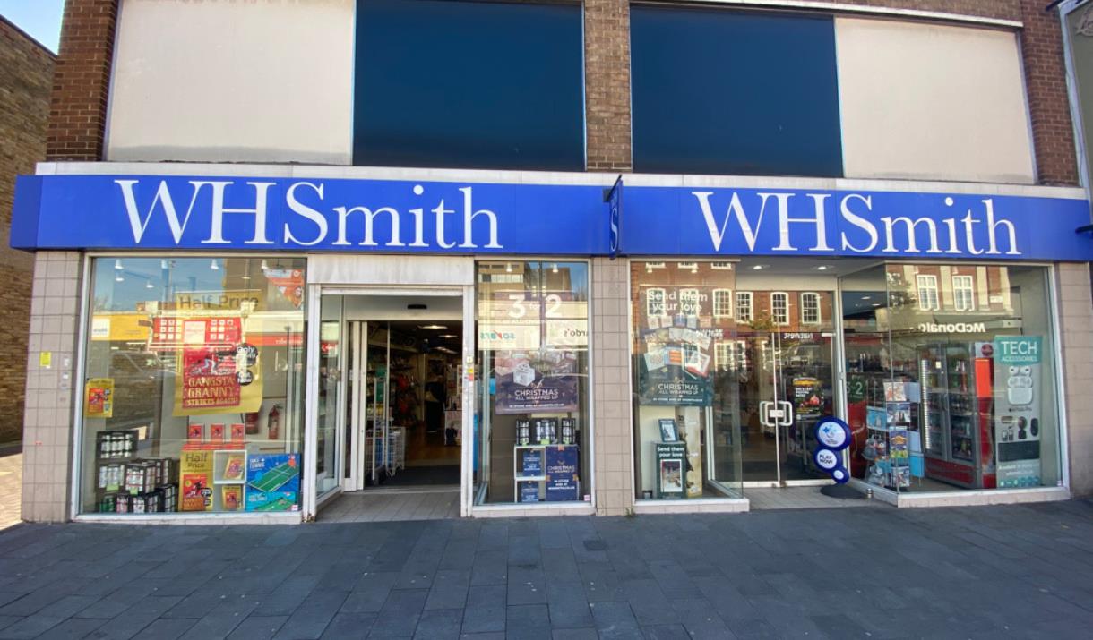 Outside WHSmith in Eltham, showing their famous blue and white logo attached to a welcoming shop.
