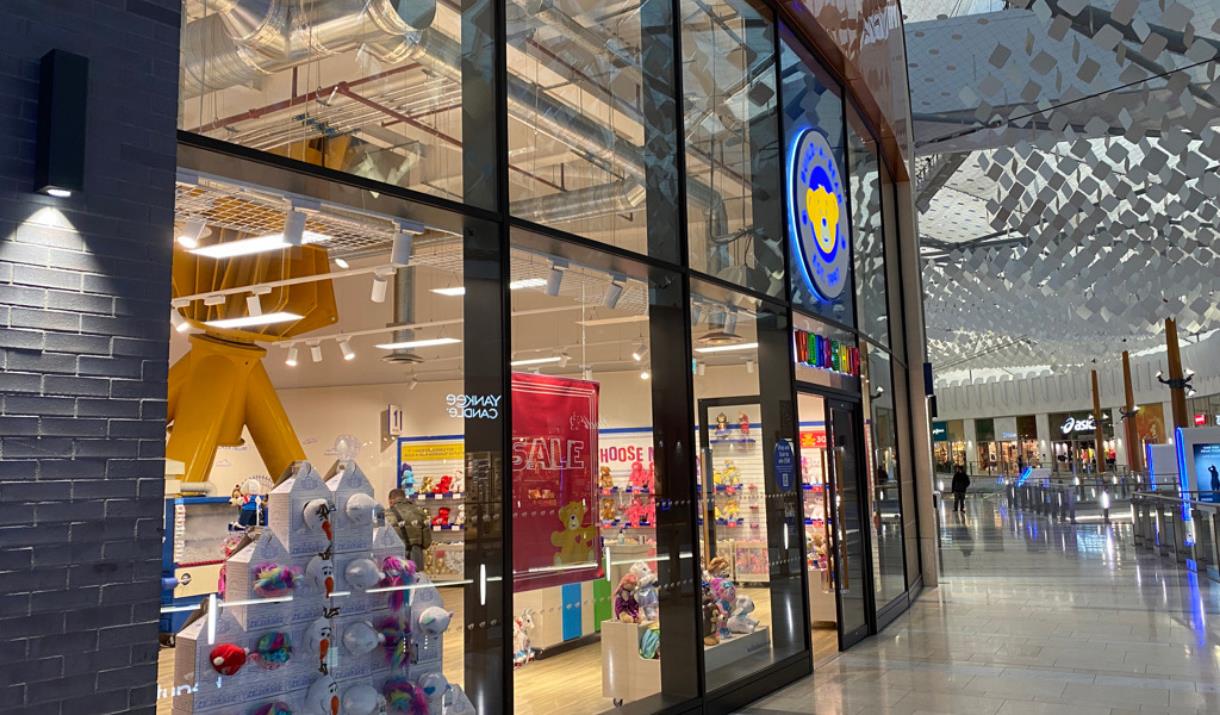 Outside Build-A-Bear at The O2. Showing a large building with windows revealing a range of toys.