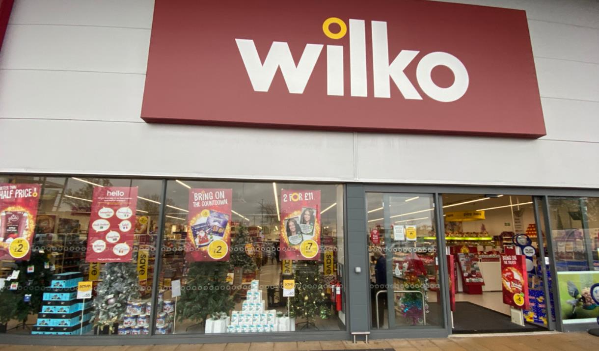 Outside Wilko in Charlton. A large shop with glass doors and a red sign outside.