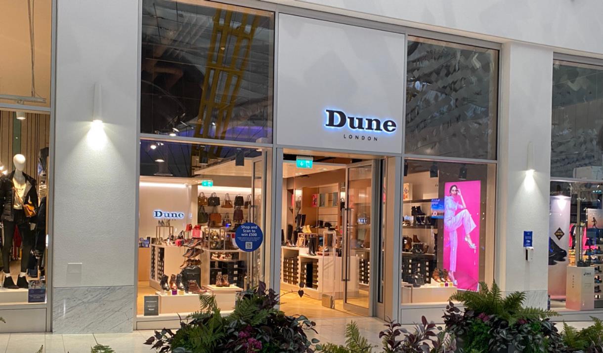 Dune at the O2. A stunning square shaped shop with a black and white design. Inside the windows are an amazing collection of footwear.