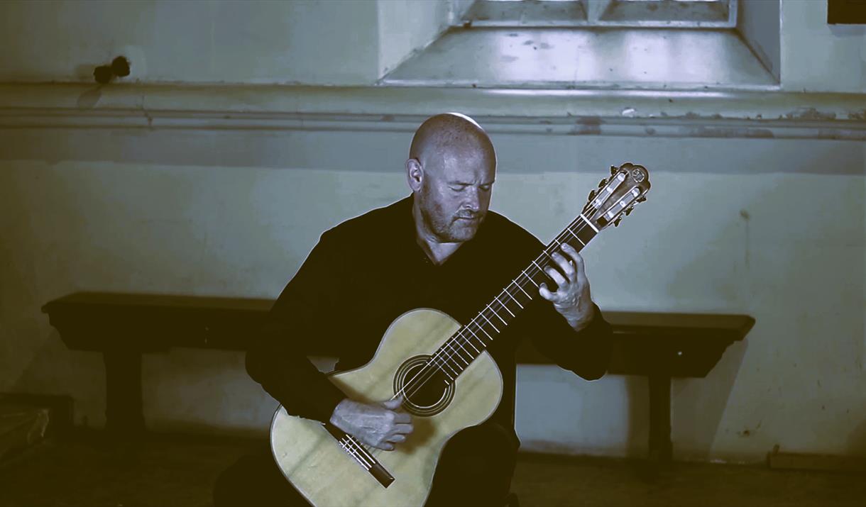 Get ready to vibe with Graham Anthony Devine as he brings the fiery spirit of Spain to life on his classical guitar