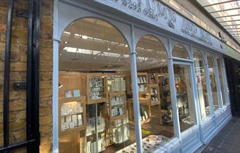 Outside Autumn and May in Greenwich, with a elegant and well presented shopfront and windows showing a stunning inside.