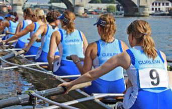 A Picture taken of people rowing, from Curlew Rowing Club.