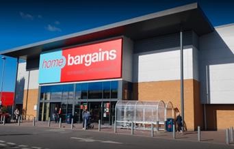 Home Bargains in Charlton. A large modern building with a blue and red banner.