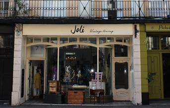 Outside Joli Vintage Living, showing a pleasant looking building filled with vintage items.