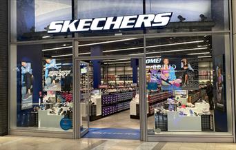 Outside Skechers at The O2. A large shop filled with stylish products.