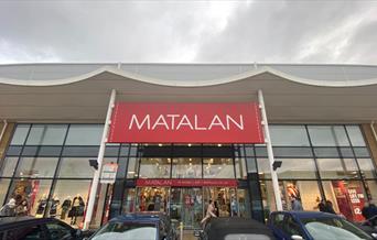 Outside Matalan in Charlton, showing a huge modern building with an amazing selection of items.