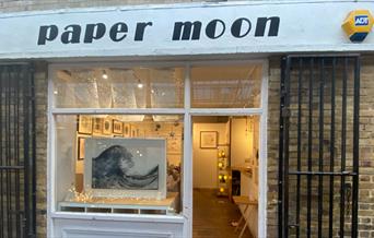 Outside Paper Moon in Greenwich. A creative and fascinating shop filled with art.